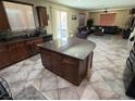 Kitchen with large granite island and view into living room at 1136 Buckhorn Cove St, Henderson, NV 89011