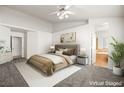 Virtually staged main bedroom with ensuite bathroom access at 1036 Aspen Daisy Ave, Henderson, NV 89074