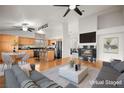 Virtually staged kitchen and living area with hardwood floors at 1036 Aspen Daisy Ave, Henderson, NV 89074