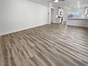 Open living space with light gray wood-look flooring at 10425 Seelos St, Las Vegas, NV 89178