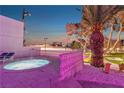 Outdoor spa area with a hot tub, lounge chairs, and views of a sports court at 1245 S Rancho Dr, Las Vegas, NV 89102