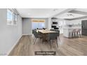 Spacious dining area with modern decor, light wood floors, and abundant natural light in an open-concept design at 139 Ivy St, Henderson, NV 89015