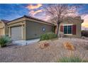 Side view of a one-story house with a brown exterior at 1460 Tannery Hts, Mesquite, NV 89034