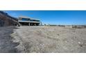 Wide view of the property lot, showing the surrounding views in the distance at 1469 Dragon Stone Pl, Henderson, NV 89012