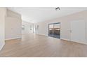 Spacious living room featuring light walls and wood-look floors at 2050 N Los Feliz St # 133, Las Vegas, NV 89156