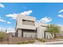 Contemporary home with clean lines and a private, walled front yard at 21 Canyon Bay Dr, Henderson, NV 89011