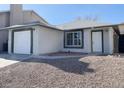 Quaint single story home featuring a garage and minimal desert landscaping in the front at 2420 Sweetgum St, Las Vegas, NV 89108