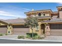 Charming two-story townhome featuring a beautiful tile roof and a two-car garage at 25 Via Mantova # 2, Henderson, NV 89011