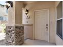 White front door with stone accents at 3555 Meridale Dr # 1145, Las Vegas, NV 89147