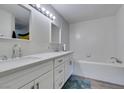 Stylish bathroom featuring a double vanity, soaking tub, and modern fixtures at 3663 Laguna Verde Way, Las Vegas, NV 89121