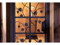 Wrought iron entry gate with grapevine details leading to the front door at 38 Strada Principale, Henderson, NV 89011