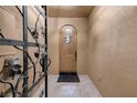 Elegant entryway with a wood door and tile flooring at 38 Strada Principale, Henderson, NV 89011