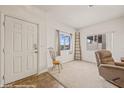 Bright entryway with tile floors, chair, and view at 457 Turtleback Rd # D, Mesquite, NV 89027