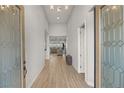 Bright and airy entryway with wood-look floors and glass doors at 5860 Noah Springs Ct, Las Vegas, NV 89149