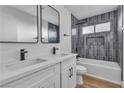 Stylish bathroom showcasing a double sink vanity, modern fixtures, and tiled shower with a tub at 6255 Adenmoor Ct, Las Vegas, NV 89156