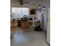 Simple kitchen with ample cabinetry and a small table at 6256 Dayton Ave, Las Vegas, NV 89107