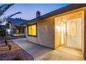 House exterior, showcasing the front entrance and landscaping at 6584 Banbridge Dr, Las Vegas, NV 89103