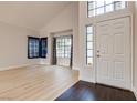 Light and airy living room with hardwood floors and large windows at 7445 Shangri La Ave, Las Vegas, NV 89147