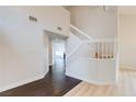 Elegant staircase with white railings leading to the upper level at 7445 Shangri La Ave, Las Vegas, NV 89147