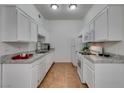 Modern kitchen featuring white cabinetry and granite countertops at 8805 Jeffreys St # 1019, Las Vegas, NV 89123