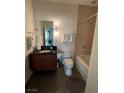 Clean bathroom with a bathtub and dark wood vanity at 900 Las Vegas Blvd # 1415, Las Vegas, NV 89101