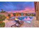 Relaxing pool area with fire pit and lounge chairs at 9705 Yellow Shadow Ave, Las Vegas, NV 89149