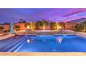 Luxury pool with fire features and spa at 9705 Yellow Shadow Ave, Las Vegas, NV 89149