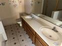 Clean bathroom with double sinks and a separate shower and tub at 1275 White Dr, Las Vegas, NV 89119