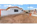 Single-story home with a white exterior and a barren front yard awaiting landscaping at 1309 Jimmy Ave, Las Vegas, NV 89106