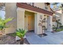 Close-up of front entrance with covered porch and meticulously maintained landscaping at 2801 N Rainbow Blvd # 255, Las Vegas, NV 89108