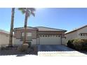 Charming single-story home featuring a two-car garage, low maintenance landscaping, and a tile roof at 3317 Barada Heights Ave, North Las Vegas, NV 89081