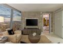 Comfortable sitting area with large TV and city views at 3722 Las Vegas Blvd # 1712, Las Vegas, NV 89158