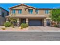 Two-story house with attached garage and landscaping at 4128 Fossatello Ave, North Las Vegas, NV 89084