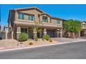 Two-story house with attached garage and landscaping at 4128 Fossatello Ave, North Las Vegas, NV 89084