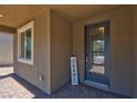 Modern front door with glass panels and welcoming home decor at 4128 Fossatello Ave, North Las Vegas, NV 89084