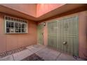 Close-up of the secure entryway with protective security doors and window bars at 413 N Lamb Blvd # E, Las Vegas, NV 89110