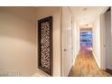 Modern hallway with hardwood floors and contemporary wall art at 4471 Dean Martin Dr # 3301, Las Vegas, NV 89103