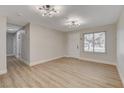Inviting living room with new floors, white walls, and a window overlooking the front yard at 4512 Mark Ave, Las Vegas, NV 89108