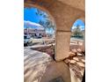 View of a community through the courtyard entrance with desert landscaping at 5266 Lisagayle Ct # 124, Las Vegas, NV 89103