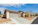 Single-story home featuring a desert landscape, a two-car garage, and a neutral color palette at 5468 Carrara Pointe St, Pahrump, NV 89061