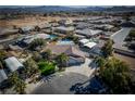 Aerial view showing a house, pool, and surrounding neighborhood at 5625 W Agate Ave, Las Vegas, NV 89139