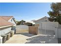 Detached garage with gated entrance, offering secure parking and additional storage space at 5625 W Agate Ave, Las Vegas, NV 89139