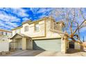 Charming two-story home featuring a well-maintained lawn and a two-car garage at 6356 Blue Twilight Ct, Las Vegas, NV 89108