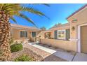 Charming home with a courtyard, a brick-paved walkway, and desert landscaping at 2277 Canyonville Dr, Henderson, NV 89044