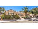 Beautiful single-story home with desert landscaping, palm tree and tile roof at 2277 Canyonville Dr, Henderson, NV 89044