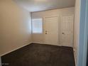Spacious bedroom with dark carpet and neutral walls at 3833 Soda Springs Dr, Las Vegas, NV 89115