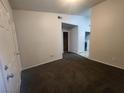 Living room with carpet and doors to other rooms at 3833 Soda Springs Dr, Las Vegas, NV 89115