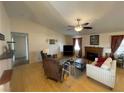 Spacious living room with hardwood floors, fireplace, and ample natural light at 520 W Leslie St, Pahrump, NV 89060