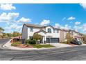 Two-story house with a two-car garage and well-manicured lawn at 5310 Esparon Ave, Las Vegas, NV 89141