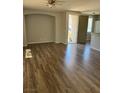 Bright, open-concept living space features hardwood floors and a ceiling fan at 6225 Dan Blocker Ave # 102, Henderson, NV 89011